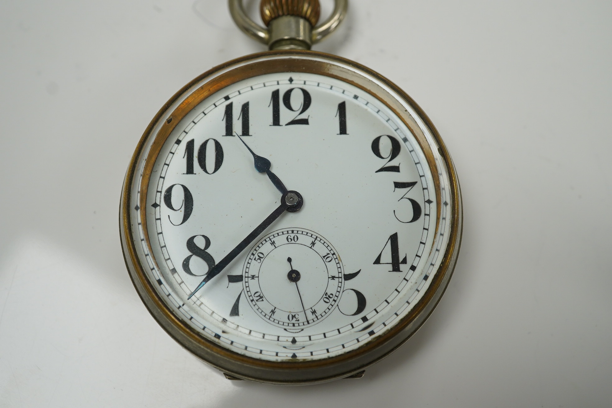 An Edwardian repousse silver mounted travelling watch case, maker W.?, Chester, 1902, 11.1cm, containing a nickel cased pocket watch. Condition - poor to fair